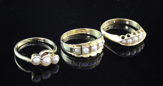 Two early 20th century 18ct gold and split pearl rings and a similar Victorian 15ct gold ring, sizes N,O&P.